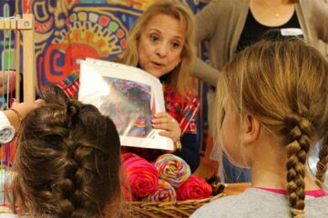 two little girls experience bright colors of multicultural crafts